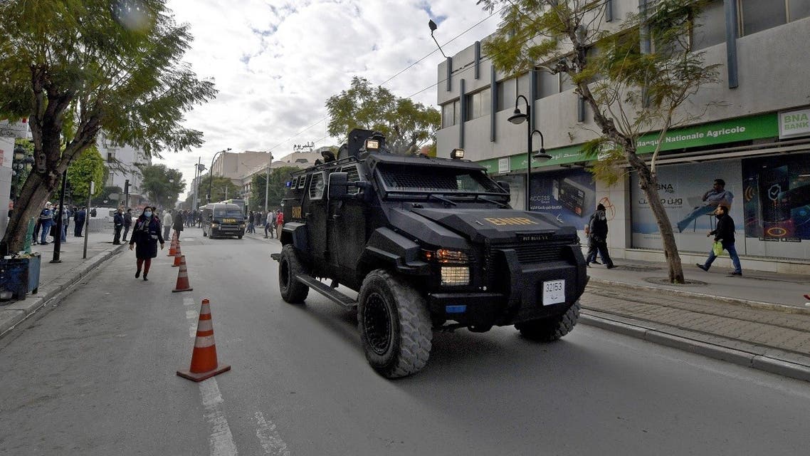 Tunisian security forces patrol along Habib Bourguiba avenue in the capital Tunis, on January 14, 2022. (AFP)