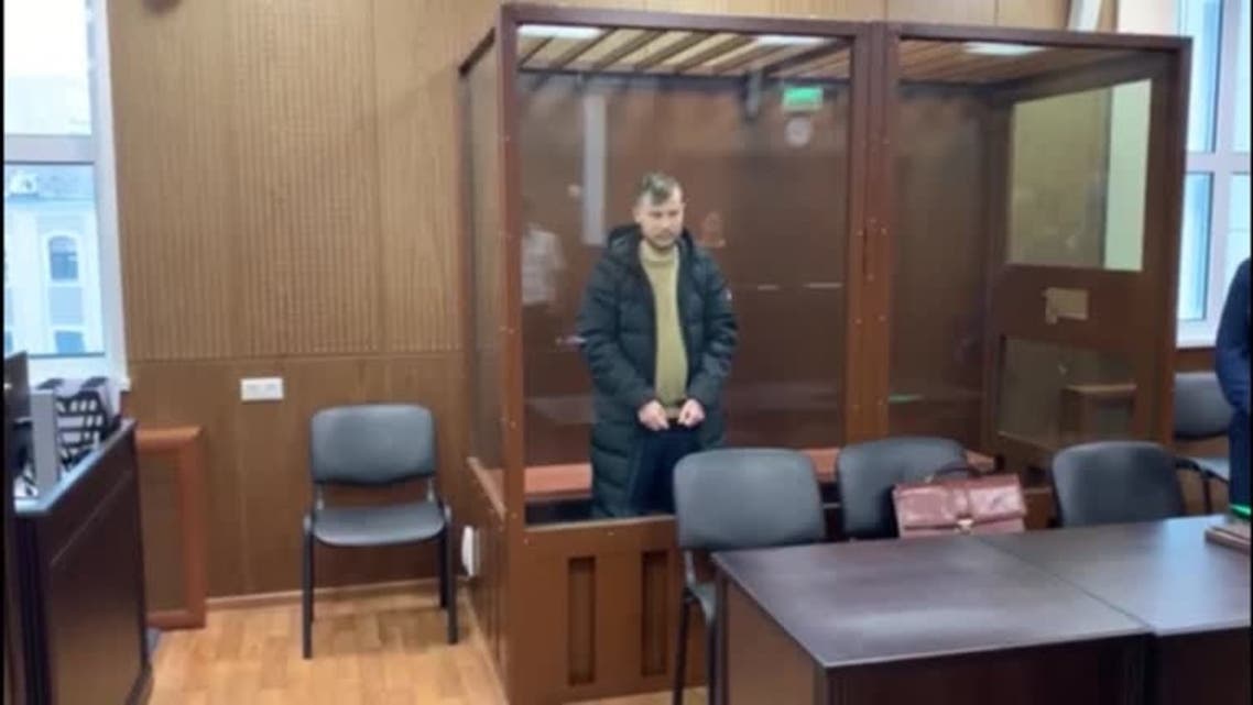 Suspected member of REvil hacking group Ruslan Khansvyarov in defendant cage. (Handout Tverskoy District Court/Reuters)