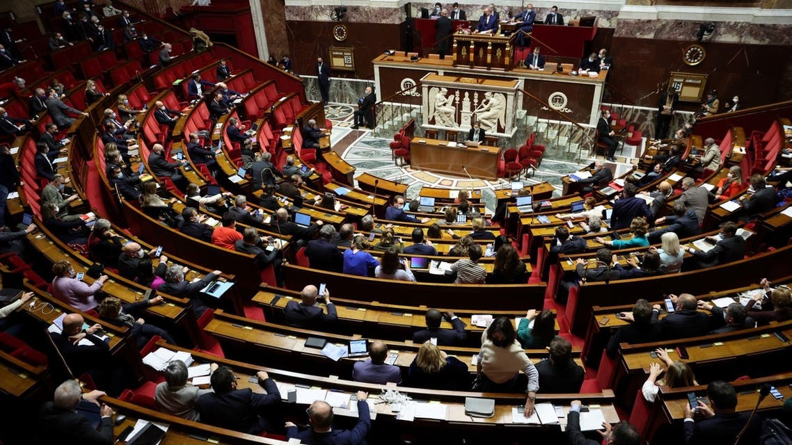 Deputies vote during the final reading of the bill introducing the vaccine pass, to strengthen the tools for managing the health crisis amid the Covid-19 pandemic at the Palais Bourbon, France's National Assembly, in Paris on January 16, 2022. (AFP)