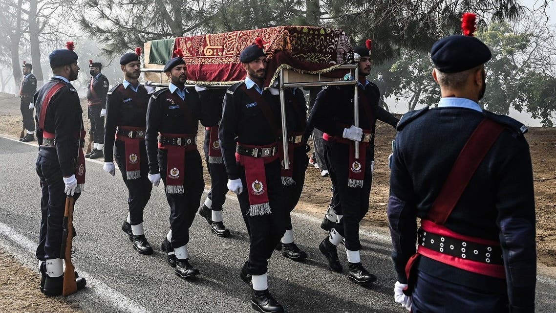 Policemen carry the coffin of a police officer who was killed in an overnight gunmen attack during the funeral ceremony in Islamabad on January 18, 2022. (AFP)