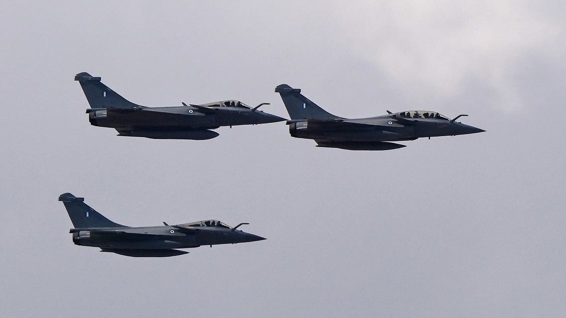 Three Rafale jet fighters fly over the city of Athens on Jan. 19, 2022. (AFP)