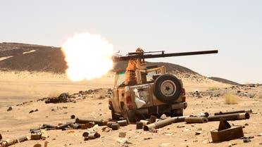A Yemeni government fighter fires a vehicle-mounted weapon at a frontline position during fighting against Houthi fighters in Marib, Yemen March 9, 2021. (Reuters)
