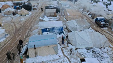 An aerial view shows a camp for internally displaced Syrians covered in snow near Afrin city in the rebel-controlled northern countryside of Syria's Aleppo province, on January 19, 2022. (AFP)