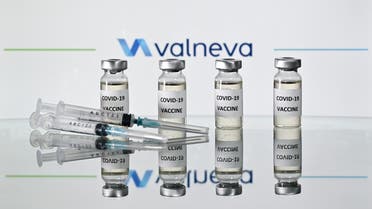 An illustration picture shows vials with Covid-19 Vaccine stickers attached and syringes with the logo of French-Austrian vaccine firm Valneva on November 17, 2020.