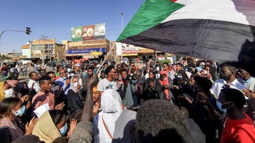 Young women and men take to the streets of the Sudanese capital Khartoum, to protest against the killings of dozens in a crackdown since last year's military coup, January 20, 2022. (AFP)
