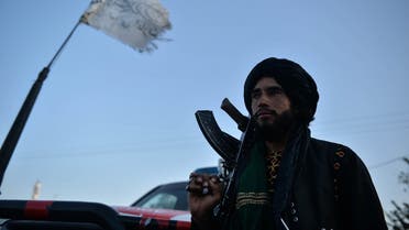 A Taliban fighter stands along a road in Herat on September 19, 2021. (AFP)