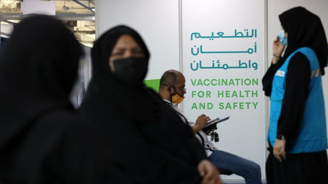 People wait their turn to get vaccinated against the coronavirus at a vaccination centre set up at the Dubai International Financial Center in the Gulf emirate of Dubai, on February 3, 2021. (AFP)
