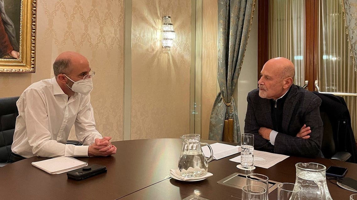 US Special Envoy for Iran Robert Malley and Barry Rosen, campaigning for the release of hostages imprisoned by Iran, sit at a table in Vienna, Jan. 23, 2022. (Reuters)