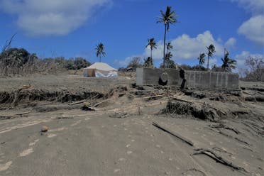 A general view shows damaged buildings and landscape covered with ash following volcanic eruption and tsunami in Kanokupolu, Tonga, January 23,2022. (Reuters)
