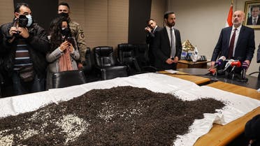 Lebanon’s Interior Minister Bassam Mawlawi (R) gives a press conference about a seizure of a cache of Captagon tablets, Beirut on January 25, 2022. (AFP)