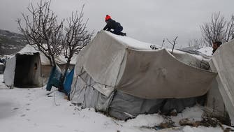 Snowstorms, cold and fire threaten displaced Syrians in northern camps