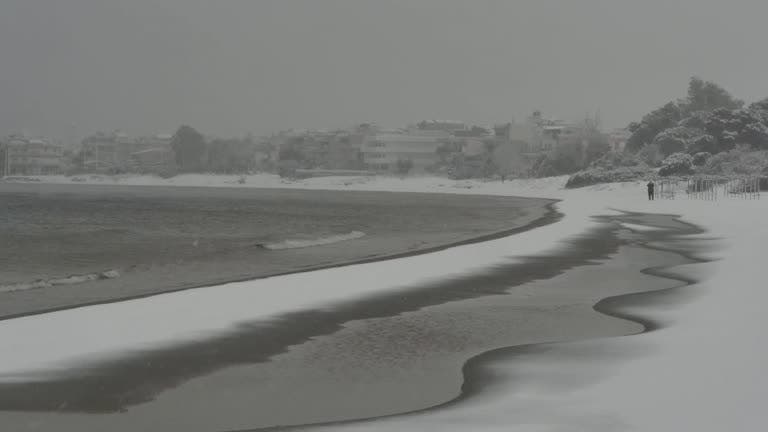 Beaches covered in snow as Greece hit by crippling snowstorm, January 24, 2022. (Reuters)
