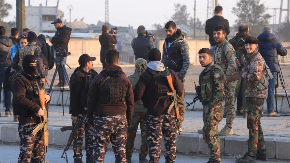 Members of the Syrian Democratic Forces (SDF) deploy outside Ghwayran prison in Syria's northeastern city of Hasakeh on January 26, 2022, after having declared over the facility following its takeover by ISIS group forces. (AFP)