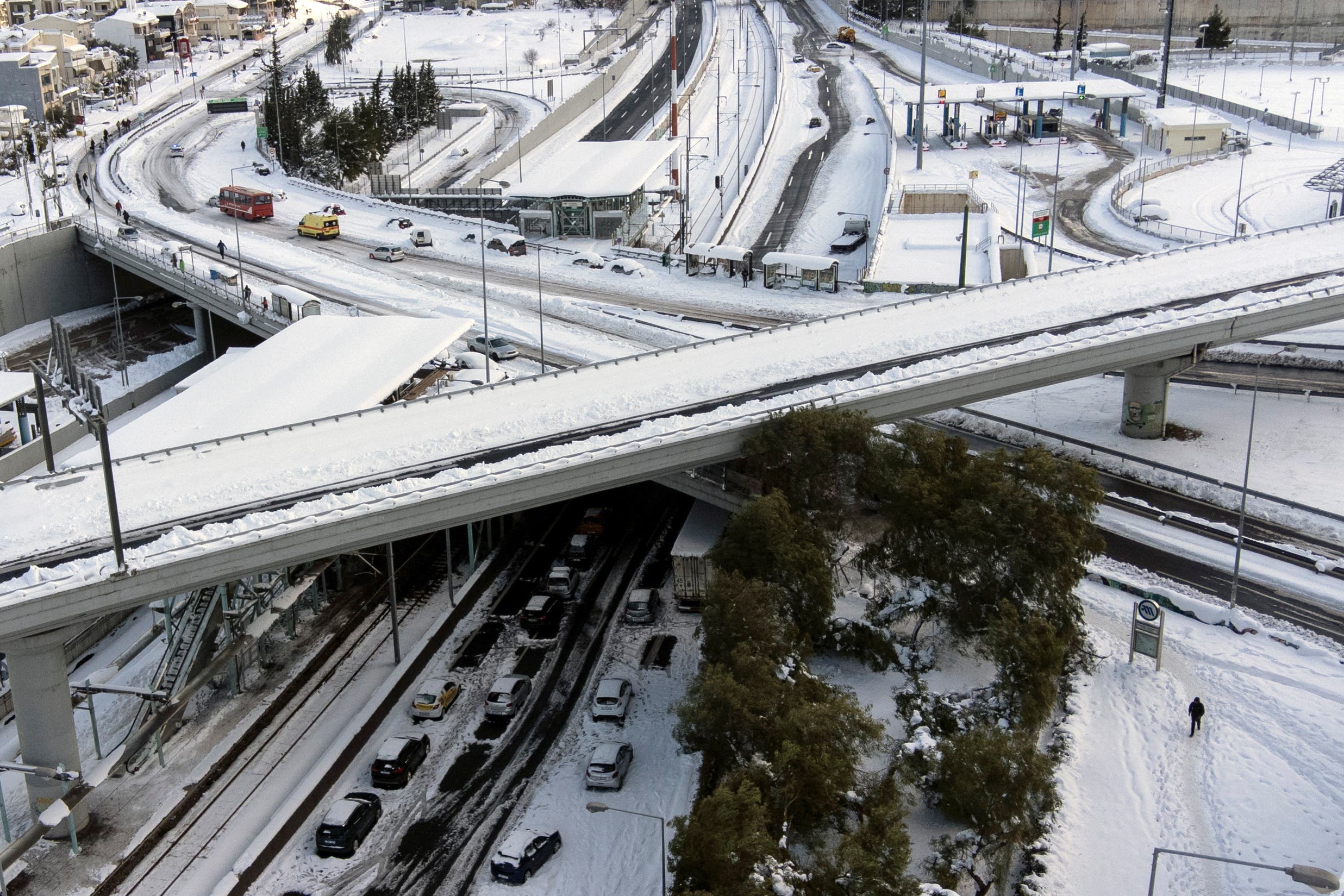 Abandoned vehicles are covered in snow on the Attiki Odos motorway, following heavy snowfall in Athens, Greece, January 25, 2022. (Reuters)