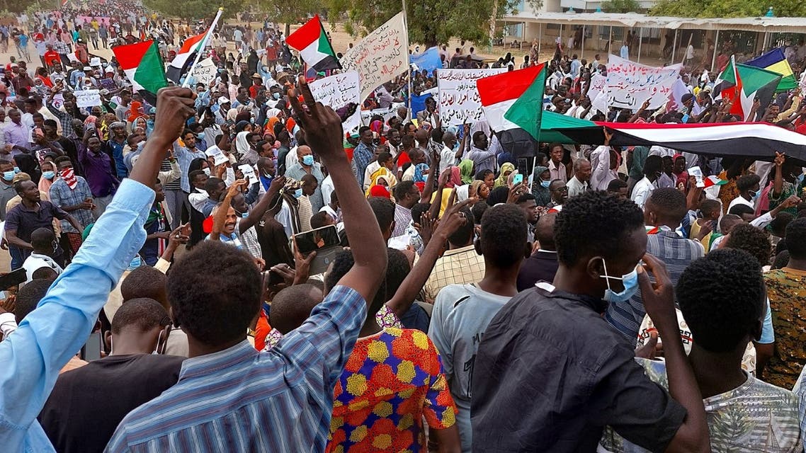 Sudanese demonstrators march in the streets of Nyala, the capital of South Darfur, to demand the government's transition to civilian rule, on October 21, 2021. (AFP)