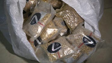 Bags of confiscated pills are displayed at the police anti-narcotics unit headquarters in Amman on January 7, 2019. The director of Jordan's anti-narcotics department told AFP there has been a 32-percent increase in drug use in Jordan since 2017.  (AFP)