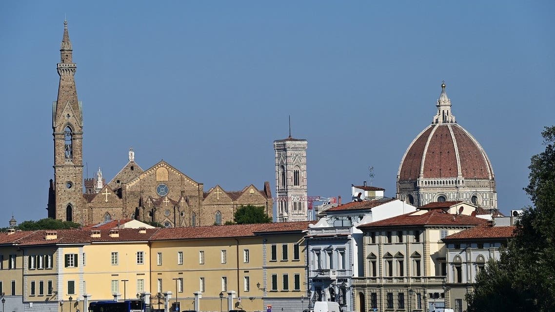 A picture taken on September 14, 2020 shows the Santa Croce church (L), the Giotto bell tower or the Bell tower and the Santa Maria del Fiore Cathedral or Duomo (R) in the center of Florence. (AFP)