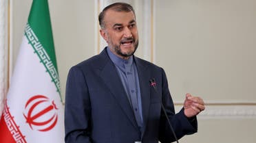 Iranian Foreign Minister Hossein Amir-Abdollahian (R) speaks during a press conference with his Syrian counterpart in the Iranian capital Tehran, on December 6, 2021. (Photo by ATTA KENARE / AFP)