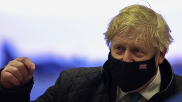 British Prime Minister Boris Johnson wears a face mask as he visits RAF Valley in Anglesey, Britain January 27, 2022. REUTERS/Carl Recine