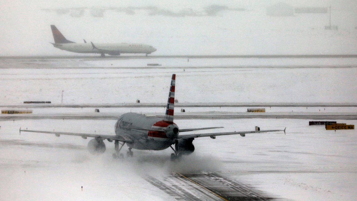 An American Airlines jet taxis down a snow-covered runway after a pre-Thanksgiving holiday snowstorm caused more than 460 flight cancellations at Denver International Airport, Colorado, U.S., November 26, 2019. (Reuters)