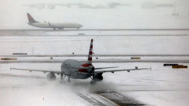 An American Airlines jet taxis down a snow-covered runway after a pre-Thanksgiving holiday snowstorm caused more than 460 flight cancellations at Denver International Airport, Colorado, U.S., November 26, 2019. (Reuters)