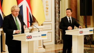 Ukrainian President Volodymyr Zelenskiy and British Prime Minister Boris Johnson react in front of the media during their meeting in Kyiv, Ukraine February 1, 2022. Ukrainian Presidential Press Service/Handout via REUTERS ATTENTION EDITORS - THIS IMAGE WAS PROVIDED BY A THIRD PARTY.