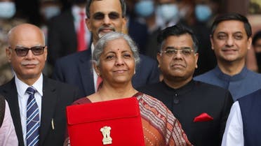 India’s Finance Minister Nirmala Sitharaman holds up a folder with the Government of India’s logo as she leaves her office to present the federal budget in the parliament in New Delhi, India, on February 1, 2022. (Reuters)