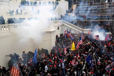  Police release tear gas into a crowd of pro-Trump protesters during clashes at a rally to contest the certification of the 2020 US presidential election results by the US Congress, at the US Capitol Building in Washington, US January 6, 2021. (Reuters)