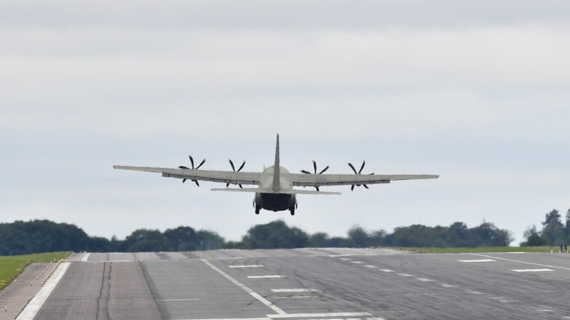 A Royal Air Force (RAF) Lockheed C-130 Hercules transport plane takes off from the airfield at RAF Brize Norton, southern England, on August 17, 2021. (AFP)