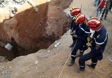 Members of the Moroccan civil defence work to rescue the five-year-old boy Rayan, who is trapped in a deep well for more than 40 hours, near Bab Berred in the rural northern province of Chefchaouen on February 3, 2022. (AFP)