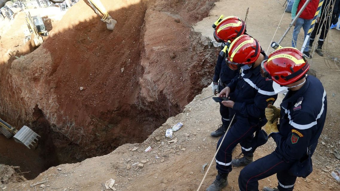 Members of the Moroccan civil defence work to rescue the five-year-old boy Rayan, who is trapped in a deep well for more than 40 hours, near Bab Berred in the rural northern province of Chefchaouen on February 3, 2022. (AFP)