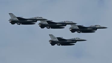 Four upgraded US-made F-16 V fighters fly during a demonstration at a ceremony at the Chiayi Air Force in southern Taiwan on November 18, 2021. (AFP)