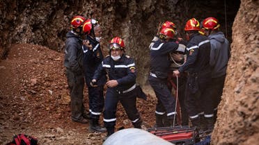 Moroccan emergency services teams work on the rescue of five-year-old boy Rayan from a well shaft he fell into on February 1, in the remote village of Ighrane in the rural northern province of Chefchaouen on February 5, 2022. (AFP)