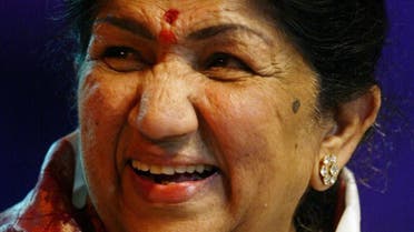 Bollywood playback singer Lata Mangeshkar smiles at a gathering which celebrated her 75th birthday in Bombay September 28, 2003. (Reuters