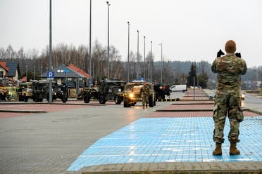 US military vehicles are seen near the G2A Arena after arriving at Rzeszow-Jasionka Airport in Jasionka, Poland on February 6, 2022. (Reuters)