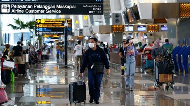 People walk with their luggage at the Soekarno-Hatta Airport in Jakarta, Indonesia. (File photo: Reuters)