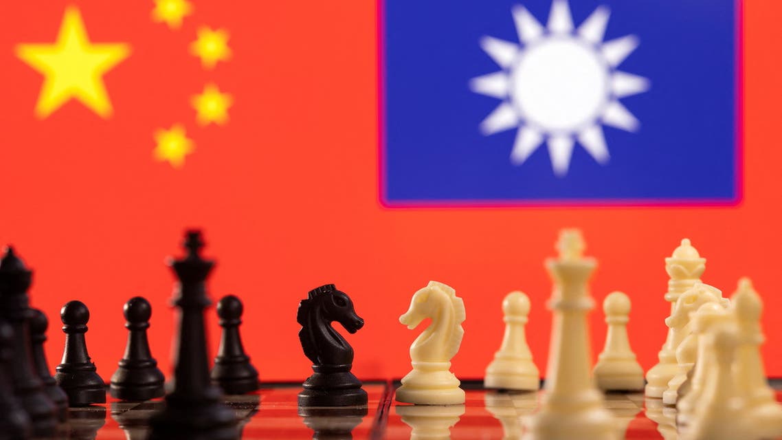 Chess pieces are seen in front of displayed China and Taiwan flags in this illustration taken January 25, 2022. (Reuters)