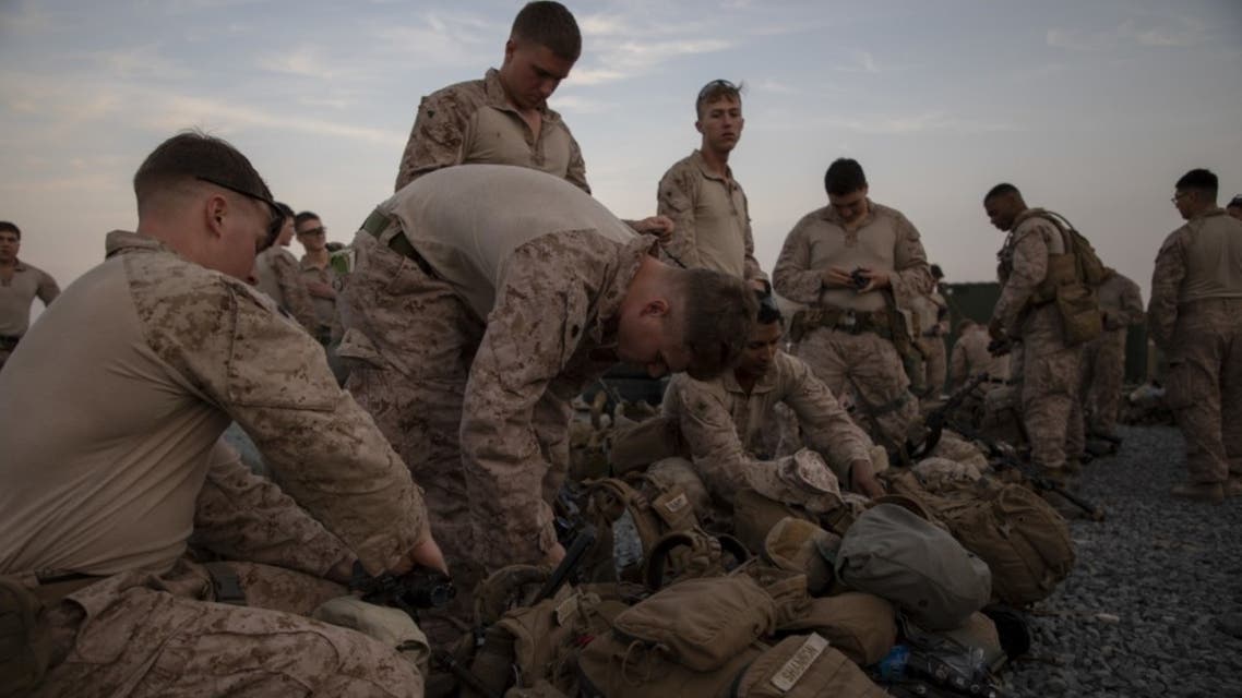 This handout image released courtesy of the US Department of Defense (DOD) shows US Marines assigned to Special Purpose Marine Air-Ground Task Force-Crisis Response-Central Command (SPMAFTF-CR-CC) 19.2, preparing to deploy from Kuwait to support the personnel at the Embassy in Baghdad December 31, 2019. (AFP)