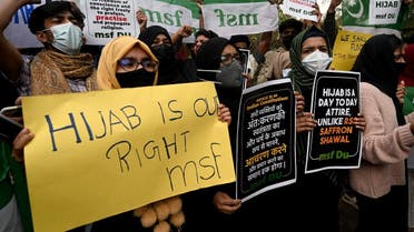 Activists from Muslim student federation shout slogans during a demonstration in New Delhi on February 8, 2022. (AFP)