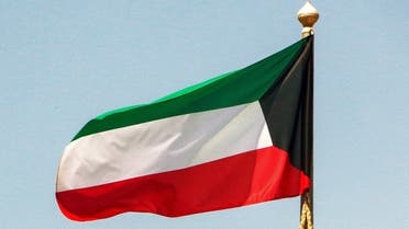 This picture taken on September 20, 2020 shows a Kuwaiti national flag flying from a mast in Kuwait City. (AFP)