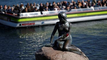 ourists take pictures of the Little Mermaid (Den lille Havfrue) bronze statue in Copenhagen, Denmark April 29, 2018. REUTERS