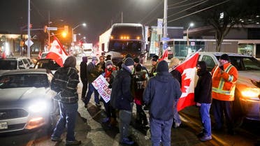 Protestors block the last entrance to the Ambassador Bridge, which connects Detroit and Windsor, effectively shutting it down as truckers and their supporters continue to protest against the coronavirus disease (COVID-19) vaccine mandates, in Windsor, Ontario, Canada February 9, 2022. (Reuters)
