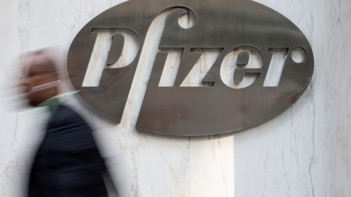 A man walks past Pfizer's world headquarters in New York April 28, 2014. Pfizer Inc has approached U.S. cancer drug maker Medivation Inc to express interest in an acquisition, raising the possibility of a bid rivaling a $9.3 billion offer by Sanofi SA, people familiar with the matter said on May 3, 2016. (Reuters)