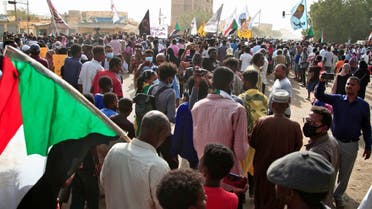 People march during a demonstration calling for civilian rule and denouncing the military administration, in the south of Sudan's capital Khartoum on February 10, 2022. (AFP)