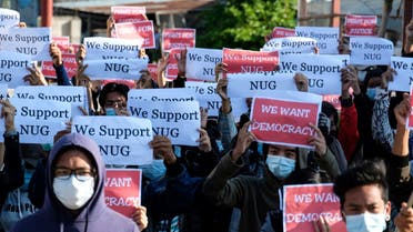 In this file photo taken on May 02, 2021 protesters hold posters in support of the National Unity Government (NUG) during a demonstration against the military coup on Global Myanmar Spring Revolution Day in Taunggyi, Shan state. (AFP)