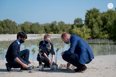 Britain's Prince William plants trees with local schoolchildren at Jubail Mangrove Park in Abu Dhabi, UAE, on Thursday February 10 2022. (WAM)