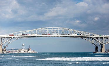 Commercial Trucks cross over the Blue Water Bridge into Canada from Port Huron, Michigan, U.S., February 9, 2022. (Reuters)