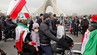 Iranians take part in a rally marking the 43rd anniversary of the 1979 Islamic Revolution, at the Azadi (Freedom) square in Tehran, on February 11, 2022. (AFP)