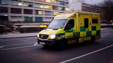 An ambulance passes the Emergency Department at St Thomas’ Hospital in London on December 29, 2020. (AFP)