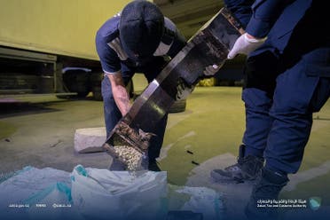 Saudi Arabia's ZATCA authority empty a concealed container filled with the illegal Captagon drug in a seizure reported on February 11, 2022. (ZATCA)